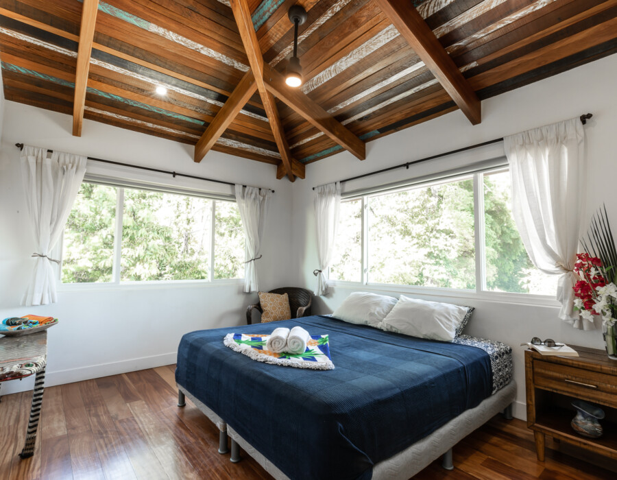 Bright room with double bed and large windows