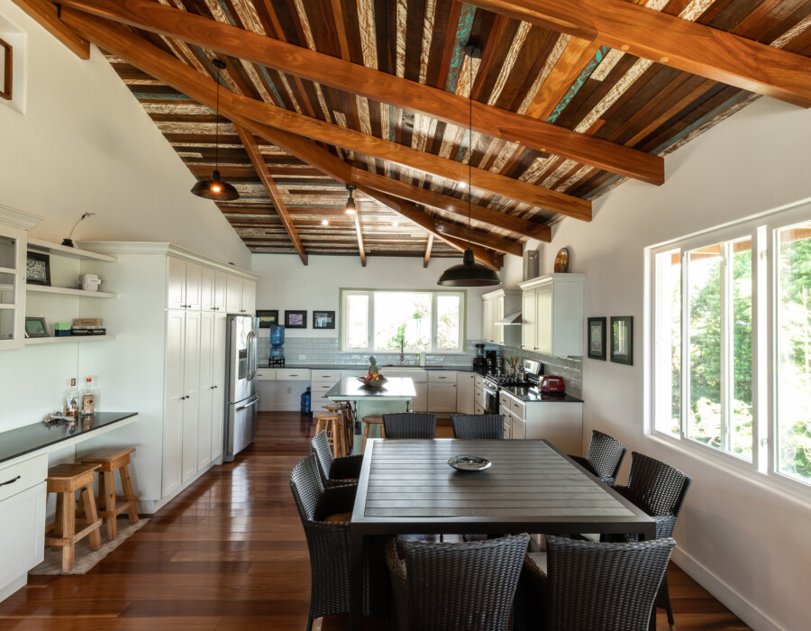 full view of the kitchen, dining room, and desk-style bar. Casa Colby