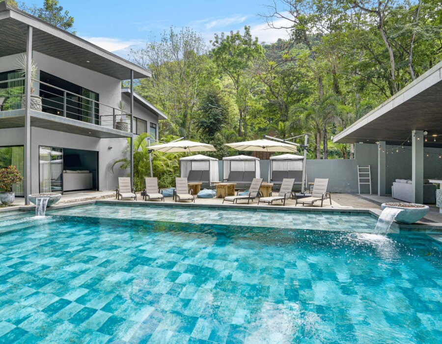 View of the house, pool, recreation area, and ranch with BBQ and pool table. At Seven Ranch