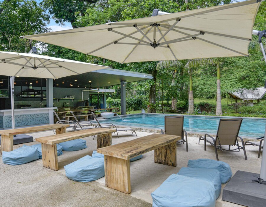 Benches and poolside lounge area overlooking the river at Seven Ranch
