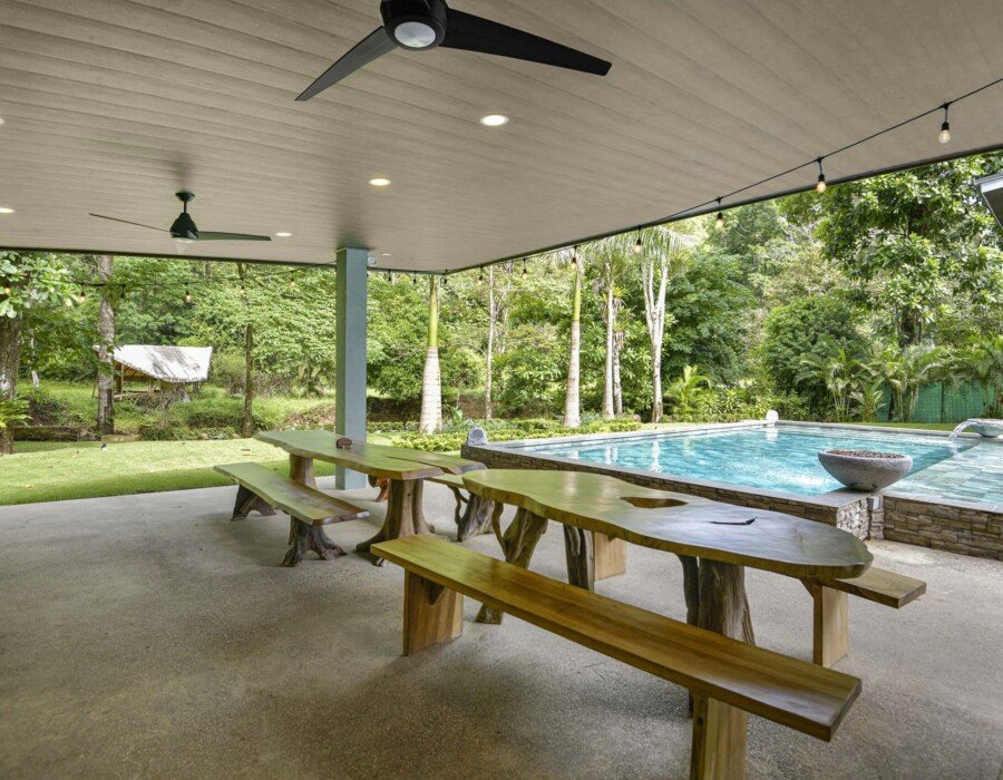 Designer wooden tables in the outdoor area for more than 16 people at Seven Ranch