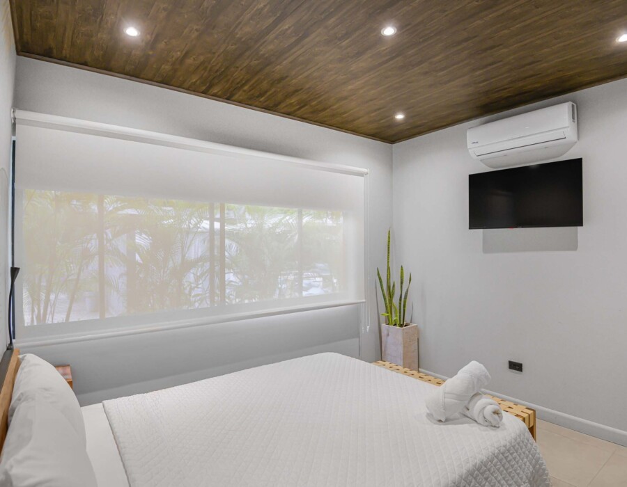 Room 2 with a double bed and lots of natural light in Seven Ranch