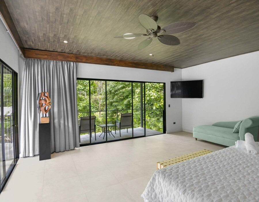 Spacious master bedroom with sofa in Seven Ranch