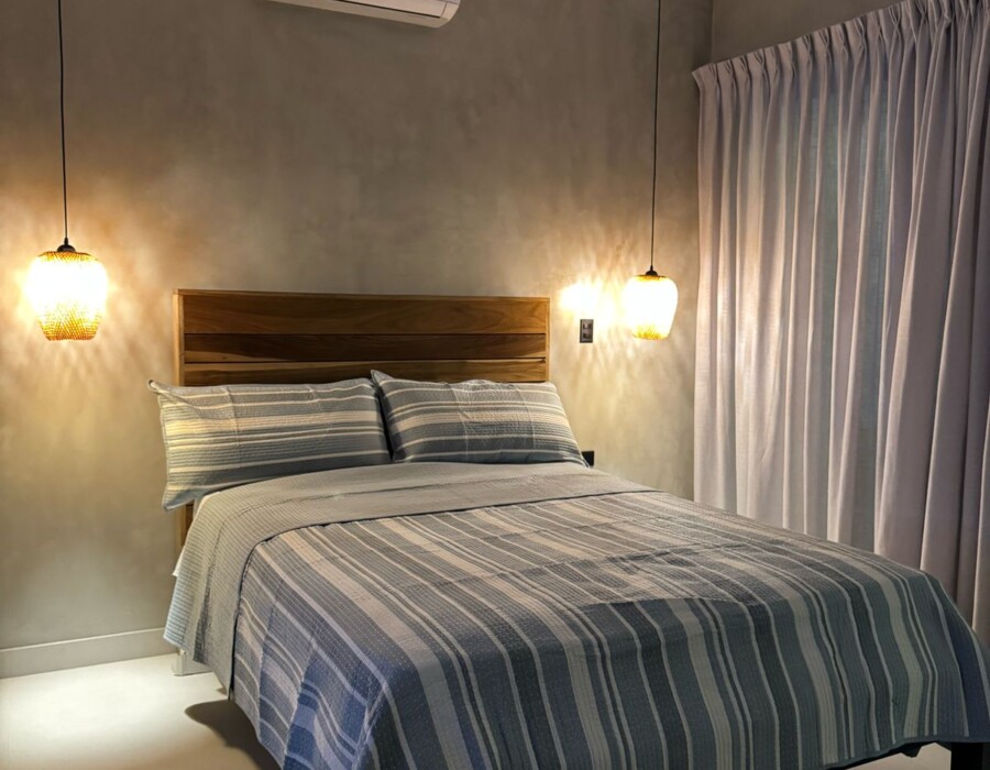 Room with lights and a double bed at Casa Brisa