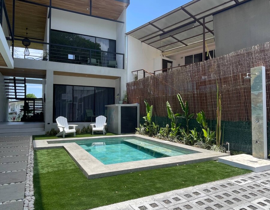 View of the garden and pool at Casa Brisa