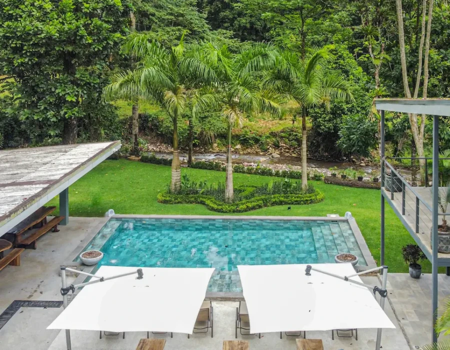 Drone shot of the pool with hammocks and loungers at Seven Ranch
