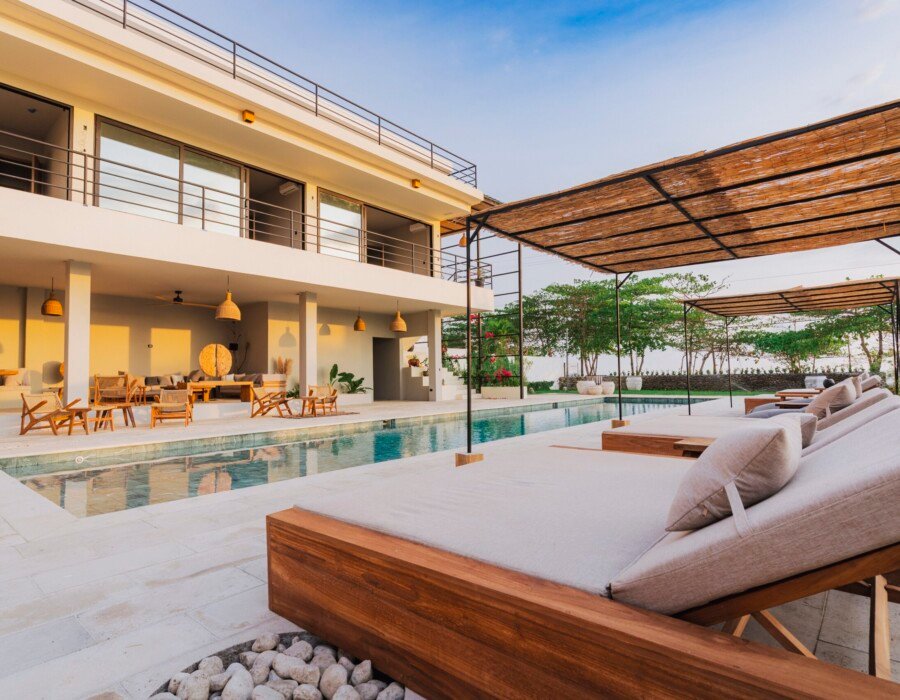 Beachfront pool with lounge chairs at Selvamar villa in Playa Hermosa near Jaco Costa Rica