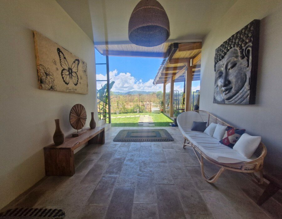Indoor sofa seating area with natural light in Costa Rica luxury villa