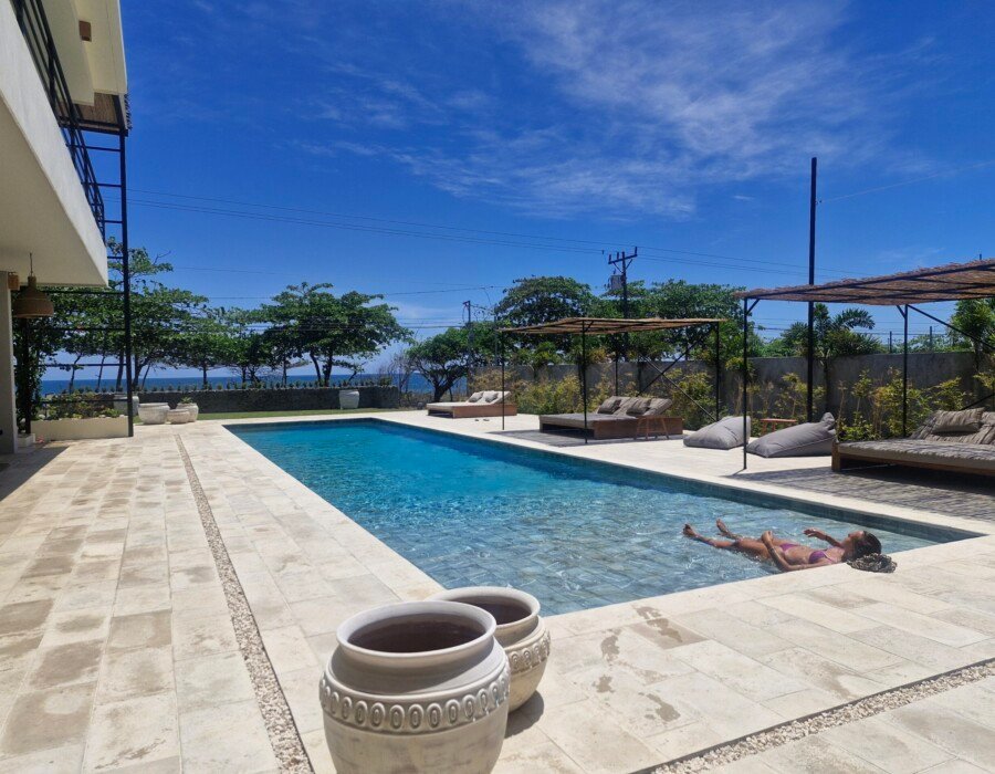 Long swimming pool with lounge area in Playa Hermosa luxury villa