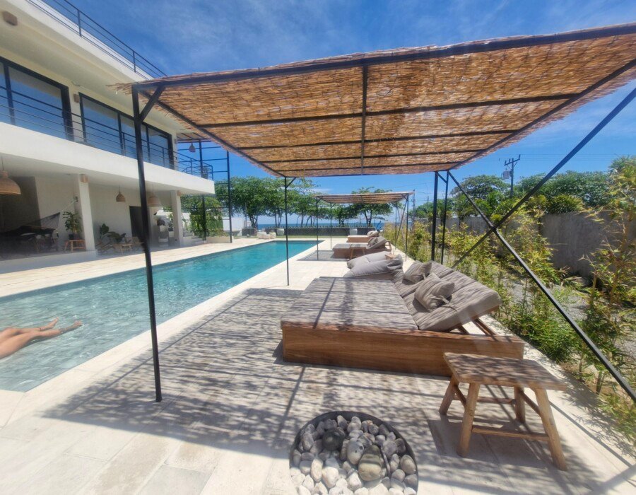 Long swimming pool with lounge area in Playa Hermosa luxury villa
