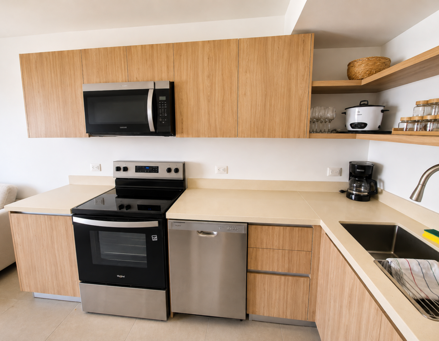 Modern kitchen with wood cabinetry at Casa Live 1708
