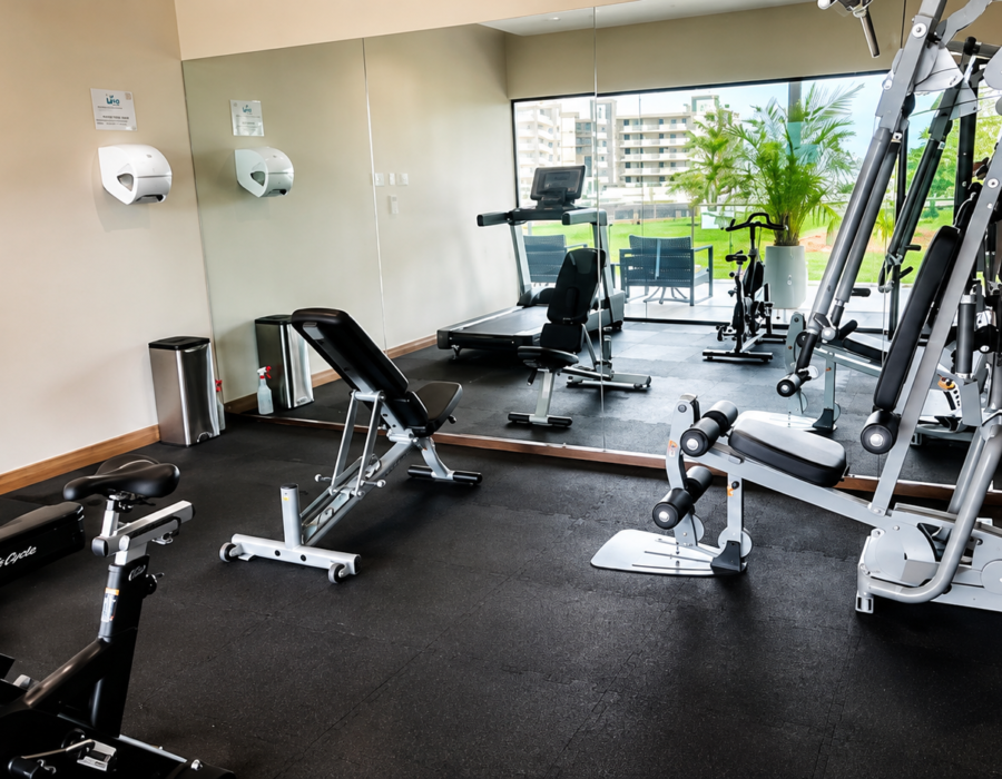 Fitness center with exercise equipment at Casa Live 1708