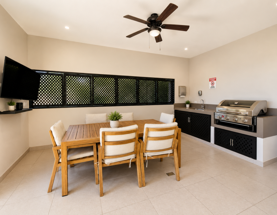 Covered outdoor dining area with BBQ at Casa Live 1708